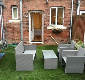 Back garden with outside tables and chairs